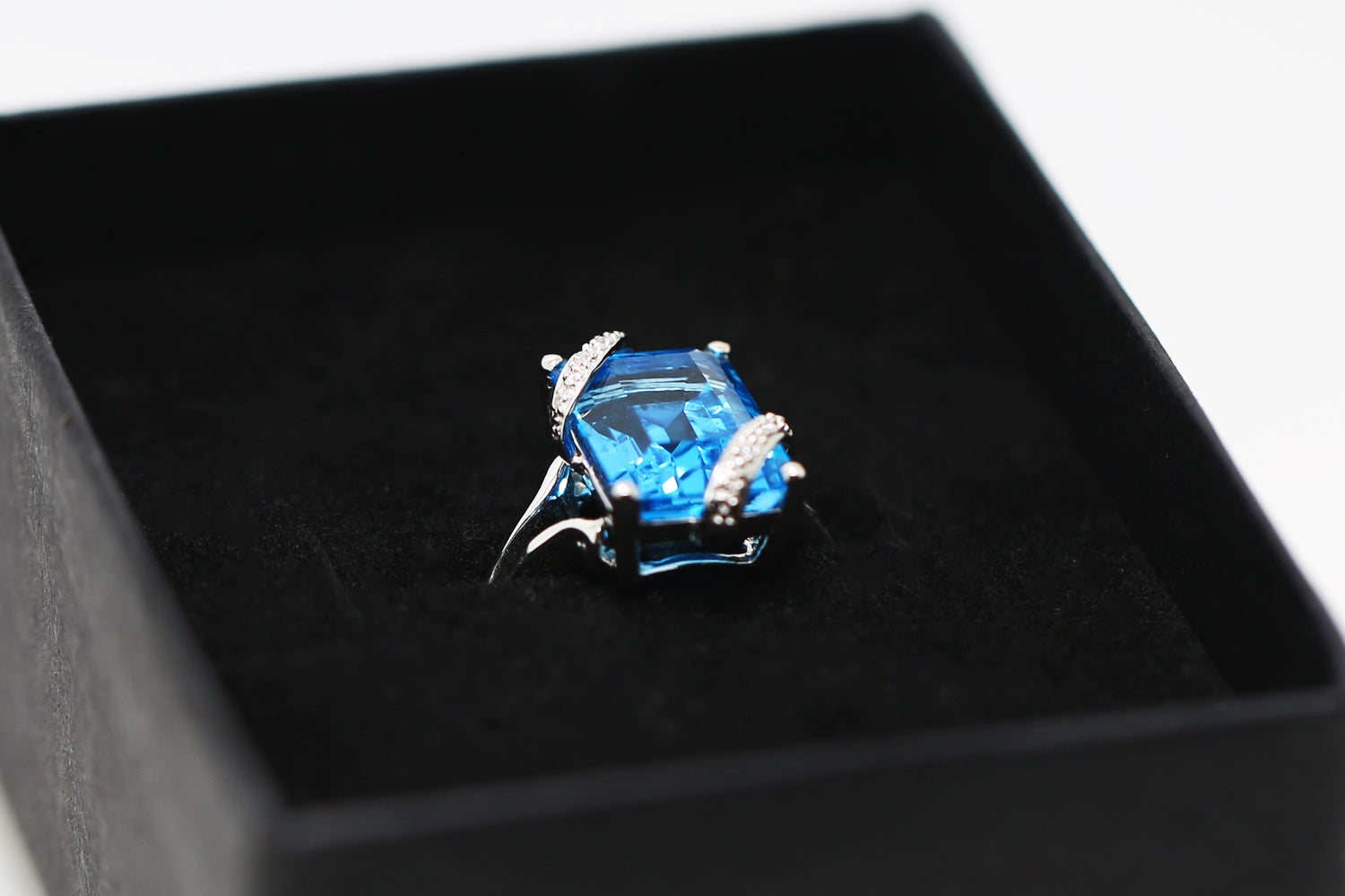 Blue Topaz and Crystal Engagement Ring