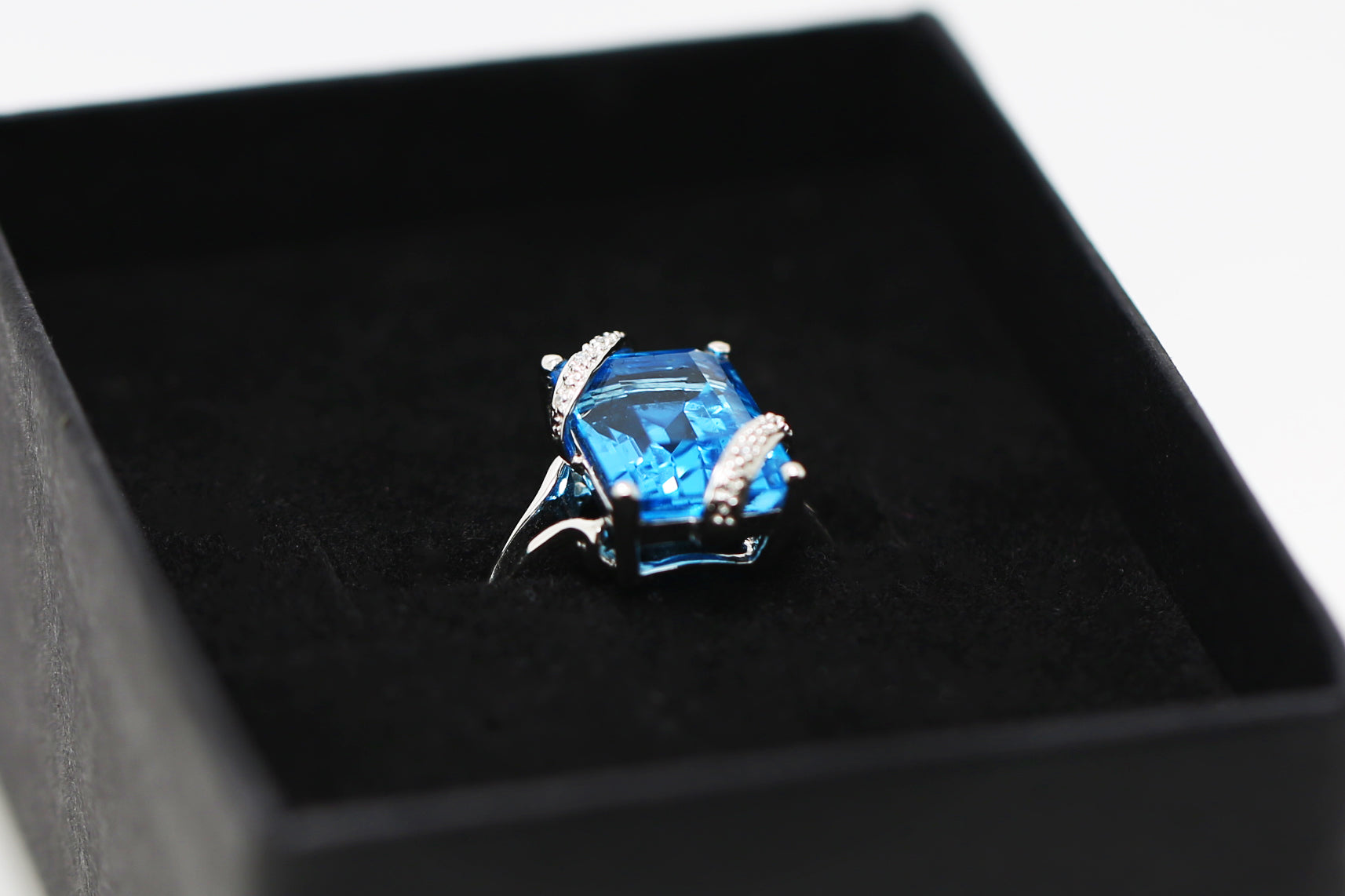 Blue Topaz and Crystal Engagement Ring